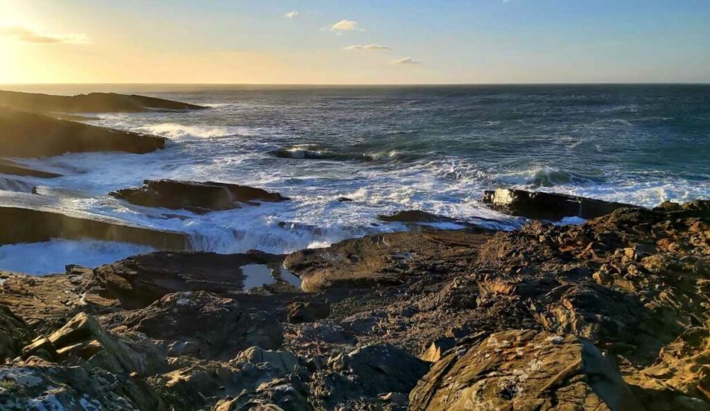 Sunset at the bridges of ross county clare, rocks and sea