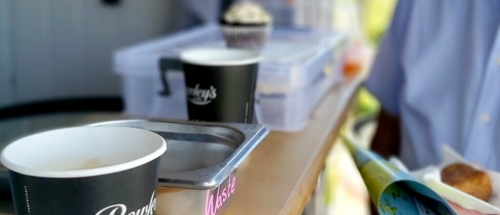 two cups of coffee at an outdoor coffe van at the start of the erris head loop walk