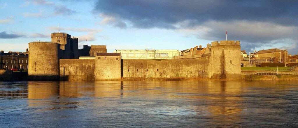 view of king johns castle in limerick across the river shannon, things to do in limerick